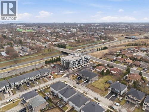 Aerial view of property's location featuring a main thoroughfare and nearby suburban area - 120 Springvalley Crescent Unit# 203, Hamilton, ON - Outdoor With View