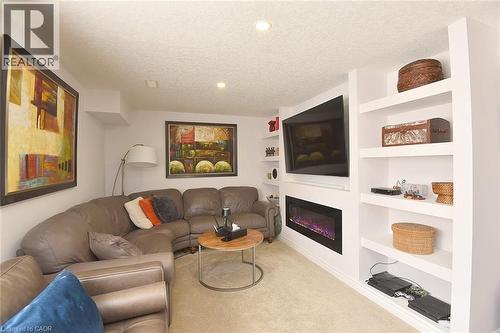 Lower Level Media Room View - 39 Panabaker Drive Unit# 7, Ancaster, ON - Indoor Photo Showing Living Room With Fireplace