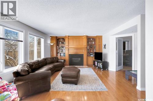 1022 Hurley Way, Saskatoon, SK - Indoor Photo Showing Living Room With Fireplace