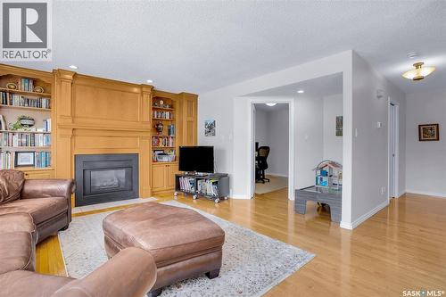 1022 Hurley Way, Saskatoon, SK - Indoor Photo Showing Living Room With Fireplace