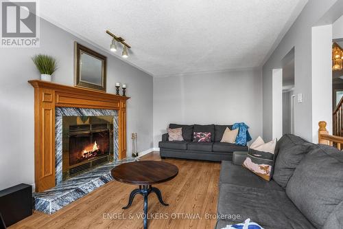 17 Hunterswood Crescent, Ottawa, ON - Indoor Photo Showing Living Room With Fireplace