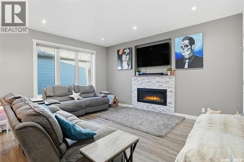 4202 Green Olive Way E, Regina, SK - Indoor Photo Showing Living Room With Fireplace