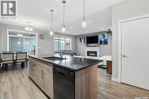 4202 Green Olive Way E, Regina, SK - Indoor Photo Showing Kitchen With Fireplace