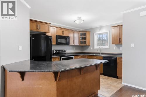 210 275 Pringle Lane, Saskatoon, SK - Indoor Photo Showing Kitchen With Double Sink