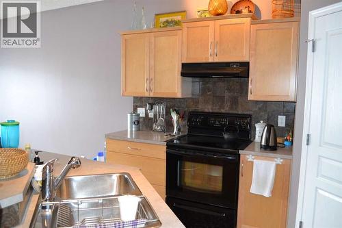 209 Lakeview Inlet, Chestermere, AB - Indoor Photo Showing Kitchen With Double Sink