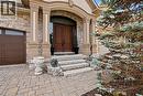 Doorway to property featuring stone siding and a garage - 205 Paige Place, Kitchener, ON  - Outdoor 