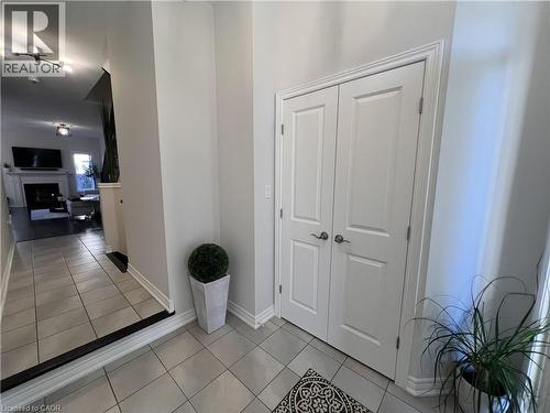 Hallway featuring light tile patterned floors and baseboards - 1165 West 5Th Street, Hamilton, ON - Indoor Photo Showing Other Room
