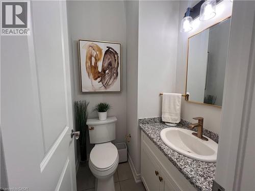 Bathroom featuring vanity and light tile patterned flooring - 1165 West 5Th Street, Hamilton, ON - Indoor Photo Showing Bathroom