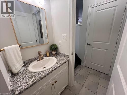 Bathroom with vanity and light tile patterned flooring - 1165 West 5Th Street, Hamilton, ON - Indoor Photo Showing Bathroom