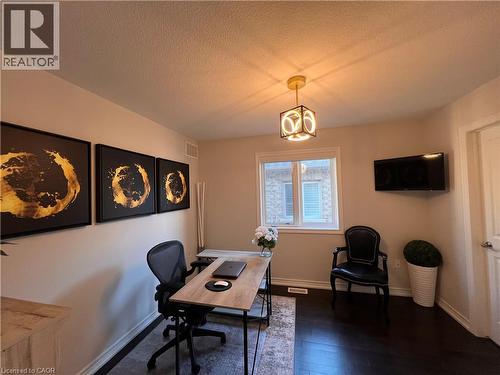Office space featuring dark wood-style floors and a textured ceiling - 1165 West 5Th Street, Hamilton, ON - Indoor Photo Showing Office