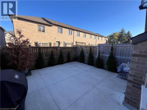 Fenced backyard featuring a patio and a grill - 1165 West 5Th Street, Hamilton, ON - Outdoor