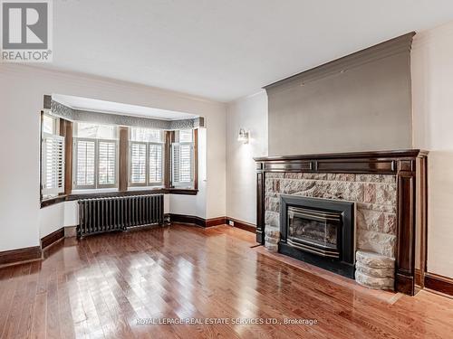 Bay window in living room - 7 Duplex Crescent, Toronto, ON - Indoor Photo Showing Living Room With Fireplace