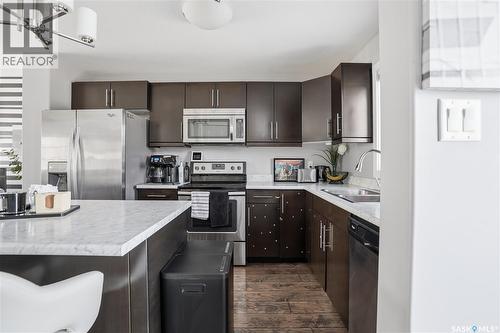 5624 Glide Crescent, Regina, SK - Indoor Photo Showing Kitchen With Stainless Steel Kitchen With Double Sink With Upgraded Kitchen