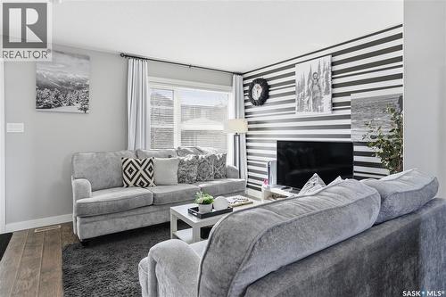 5624 Glide Crescent, Regina, SK - Indoor Photo Showing Living Room With Fireplace