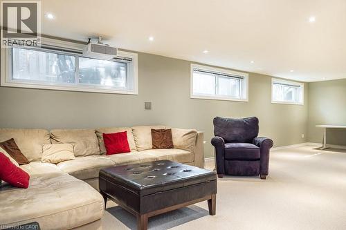 Carpeted living room with recessed lighting and baseboards - 330 Strathcona Drive, Burlington, ON - Indoor