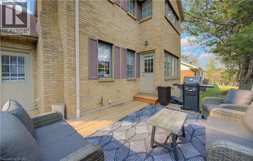 View of patio featuring grilling area, a wooden deck, and outdoor seating - 306 Roxton Drive, Waterloo, ON - Outdoor With Deck Patio Veranda With Exterior