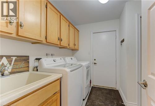 Laundry room with washer and dryer and cabinet space - 306 Roxton Drive, Waterloo, ON - Indoor Photo Showing Laundry Room