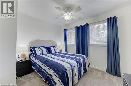 Bedroom featuring light colored carpet and ceiling fan - 306 Roxton Drive, Waterloo, ON - Indoor Photo Showing Bedroom