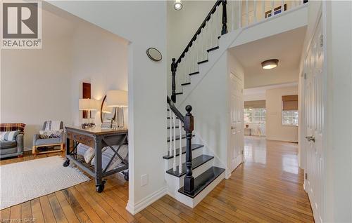 Stairway with hardwood / wood-style floors and a high ceiling - 306 Roxton Drive, Waterloo, ON - Indoor Photo Showing Other Room