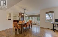 Dining space featuring light wood-style floors and baseboards - 