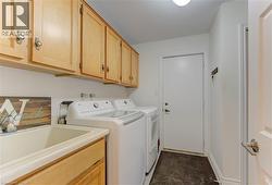 Laundry room with washer and dryer and cabinet space - 