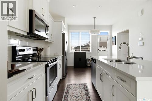 3218 Chuka Boulevard, Regina, SK - Indoor Photo Showing Kitchen With Double Sink With Upgraded Kitchen