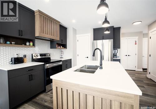 3060 Dumont Way, Regina, SK - Indoor Photo Showing Kitchen With Double Sink With Upgraded Kitchen