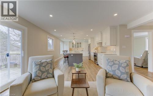 Living room with light wood-style floors and recessed lighting - 395 Warrington Drive, Waterloo, ON - Indoor Photo Showing Living Room