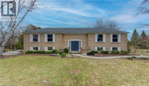 Bi-level home featuring brick siding and a front lawn - 395 Warrington Drive, Waterloo, ON - Outdoor