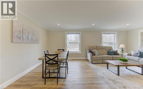 Dining space featuring light wood finished floors, crown molding, and recessed lighting - 395 Warrington Drive, Waterloo, ON - Indoor Photo Showing Living Room