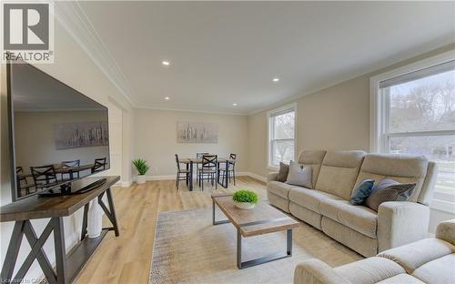 Living room featuring light wood-style flooring, recessed lighting, and crown molding - 395 Warrington Drive, Waterloo, ON - Indoor Photo Showing Living Room