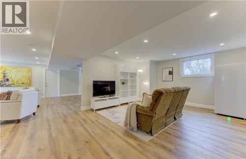 Living room featuring light wood finished floors and recessed lighting - 395 Warrington Drive, Waterloo, ON - Indoor