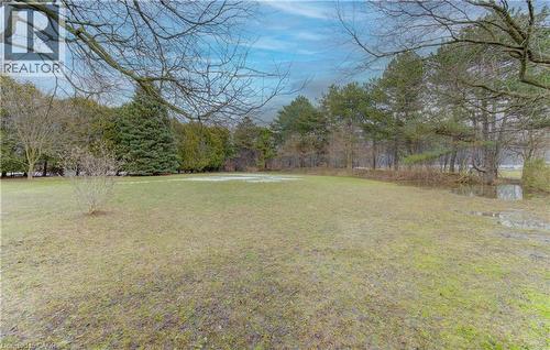 View of grassy yard - 395 Warrington Drive, Waterloo, ON - Outdoor With View