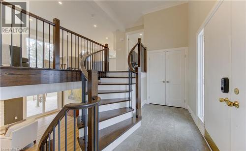 Stairway with ornamental molding and baseboards - 395 Warrington Drive, Waterloo, ON - Indoor Photo Showing Other Room