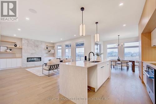 To be built. Photos for illustration - Lot 35 Virtue Drive, London South (South B), ON - Indoor Photo Showing Kitchen With Fireplace With Upgraded Kitchen