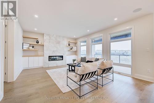 To be built. Photos for illustration - Lot 35 Virtue Drive, London South (South B), ON - Indoor Photo Showing Living Room With Fireplace