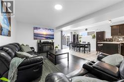 Living room with light wood-type flooring - 