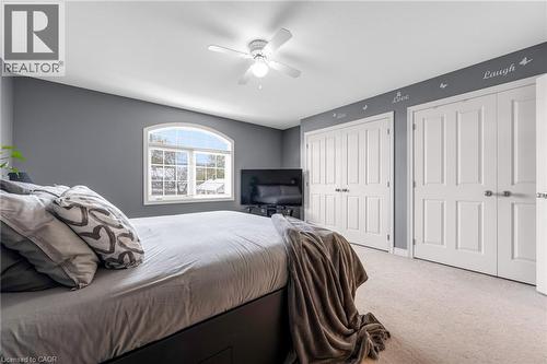Bedroom with multiple closets, carpet floors, and a ceiling fan - 160 Wallace Avenue S, Welland, ON - Indoor Photo Showing Bedroom