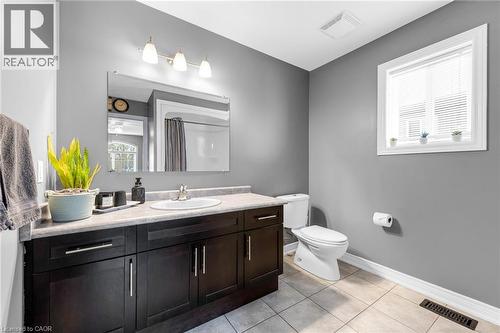 Bathroom with vanity, curtained shower, and light tile patterned flooring - 160 Wallace Avenue S, Welland, ON - Indoor Photo Showing Bathroom