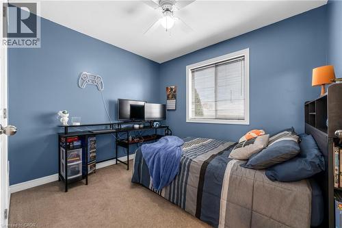 Carpeted bedroom with baseboards and a ceiling fan - 160 Wallace Avenue S, Welland, ON - Indoor Photo Showing Bedroom