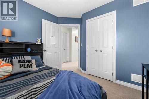 Bedroom featuring light colored carpet and a closet - 160 Wallace Avenue S, Welland, ON - Indoor Photo Showing Bedroom