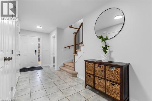 Entryway featuring stairway and light tile patterned floors - 160 Wallace Avenue S, Welland, ON - Indoor Photo Showing Other Room