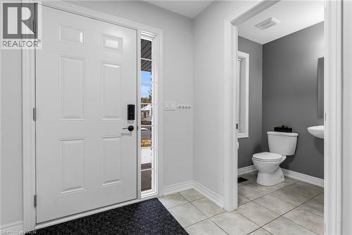 Entrance foyer featuring baseboards and light tile patterned flooring - 160 Wallace Avenue S, Welland, ON - Indoor Photo Showing Bathroom