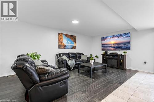 Living room featuring baseboards and light wood-style flooring - 160 Wallace Avenue S, Welland, ON - Indoor Photo Showing Living Room