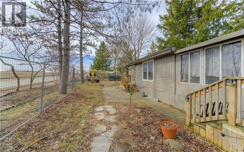 Fenced backyard with a sunroom - 580 Beaver Creek Road Unit# 11, Waterloo, ON - Outdoor