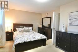 Bedroom featuring light colored carpet - 