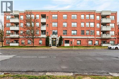 8 Main Street Unit# 101, Dundas, ON - Outdoor With Balcony With Facade