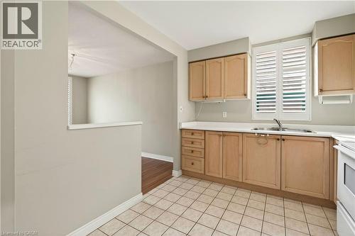 8 Main Street Unit# 101, Dundas, ON - Indoor Photo Showing Kitchen With Double Sink