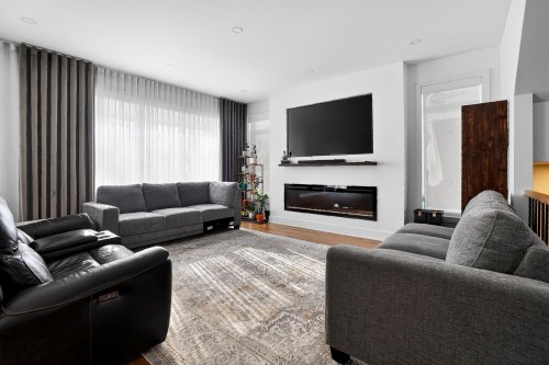 Salon - 415 Rue Vanier, Brossard, QC - Indoor Photo Showing Living Room With Fireplace