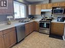 13 Manson Crescent, Mackenzie, BC  - Indoor Photo Showing Kitchen With Double Sink 